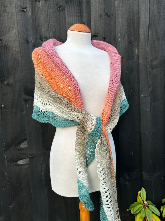 Unique hand knitted extremely shallow crescent wrap scarf in soft wool yarn cake