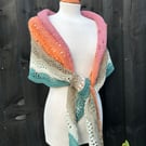 Unique hand knitted extremely shallow crescent wrap scarf in soft wool yarn cake