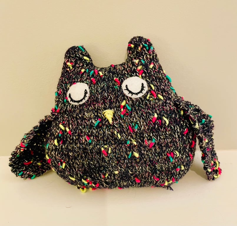 Knitted sleepy black owl ornament with  metallic  bobbles