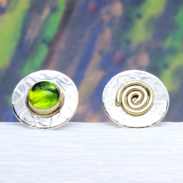 Handmade sterling silver ear studs with a Peridot stone and a swirl.