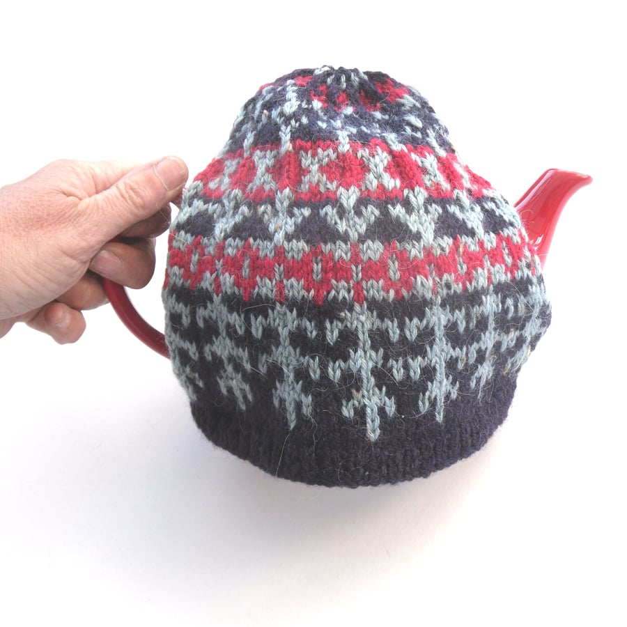 Colourful hand knit tea cosy