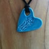 Large CeramicTurquoise Pendant Heart Necklace Impressed with  flowers.