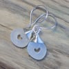 Sea glass earrings with drilled hearts and sterling silver hooks