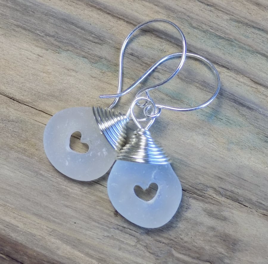 Sea glass earrings with drilled hearts and sterling silver hooks