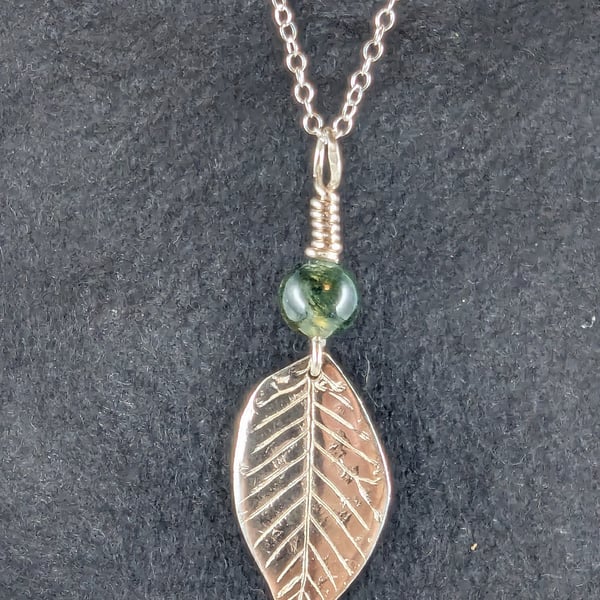 Silver pendant necklace with green bead