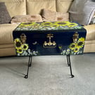 A large hand painted and sealed metal trunk table by Andrew Jenkins 