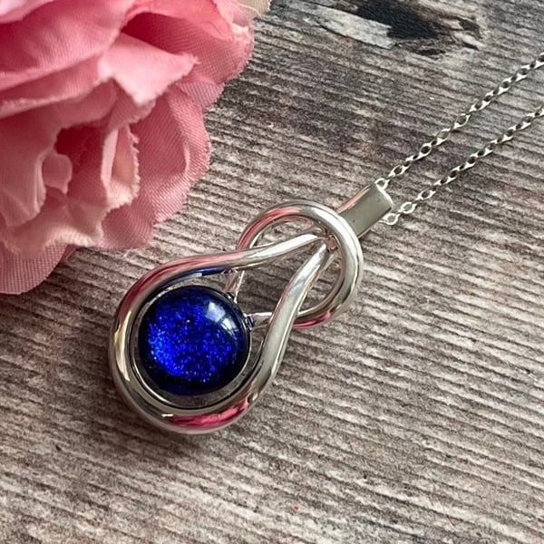 Dark blue fused glass teardrop knot pendant, deep blue sparkly silver necklace
