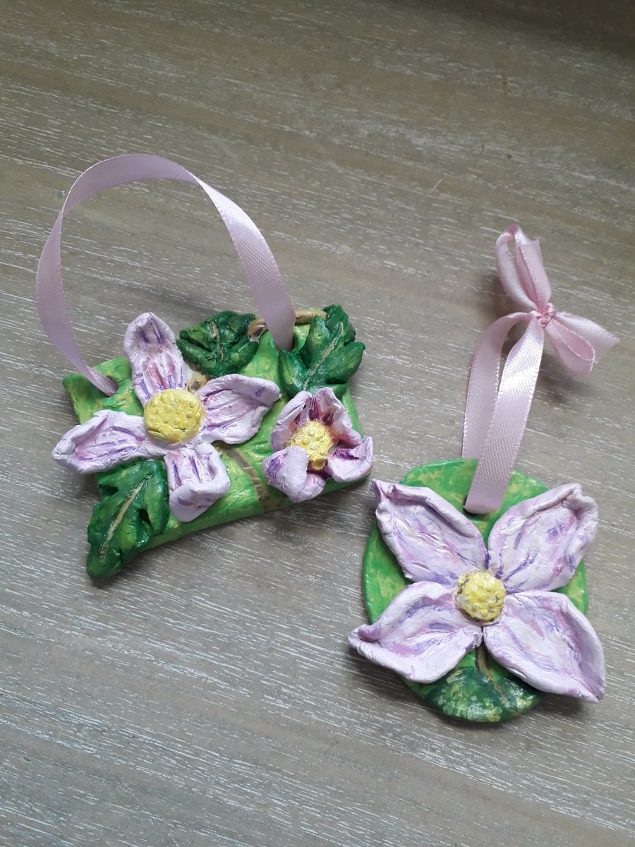 A pair of rustic 'pink clematis" clay hanging sculptures.  