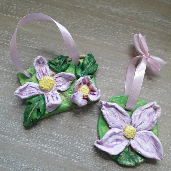 A pair of rustic 'pink clematis" clay hanging sculptures.  