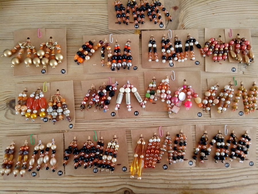 Sets of colour coordinated beaded gift decorations.