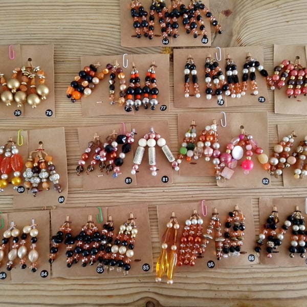 Sets of colour coordinated beaded gift decorations.