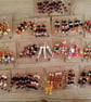 Sets of colour coordinated beaded gift decorations.