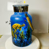 A hand painted and fired metal and glass lantern by Andrew Jenkins 