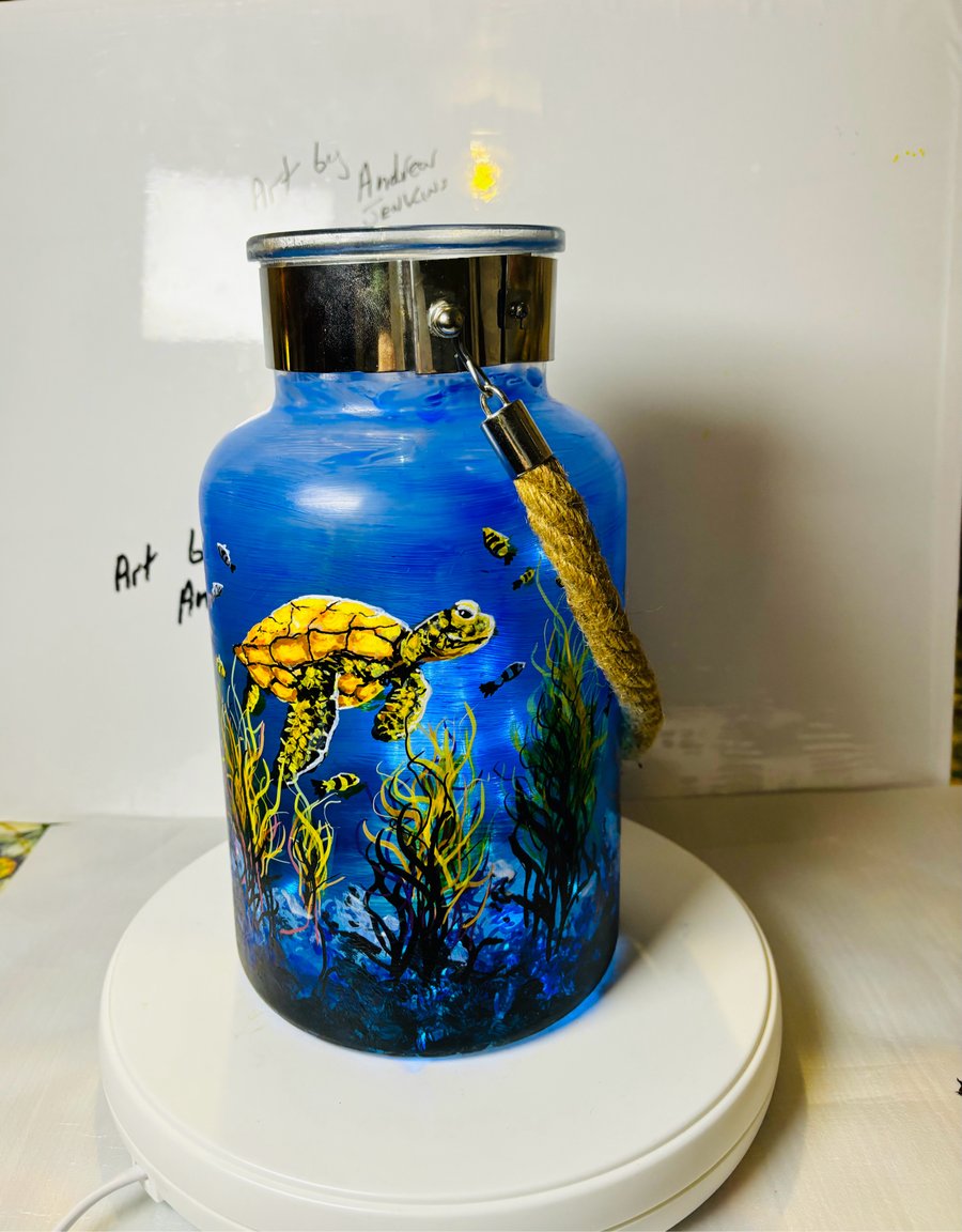 A hand painted and fired metal and glass lantern by Andrew Jenkins 