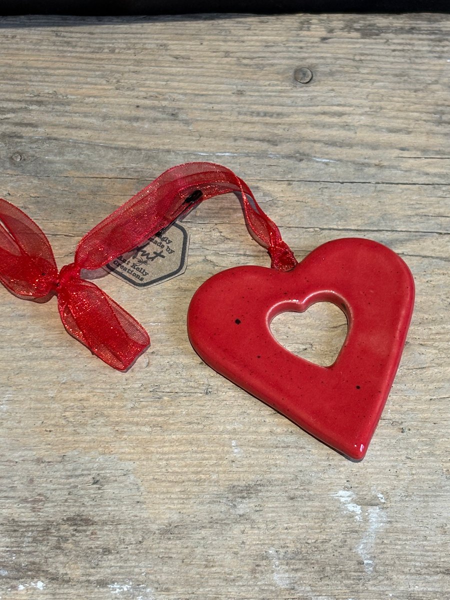 Red heart hanging decorations with cut out heart