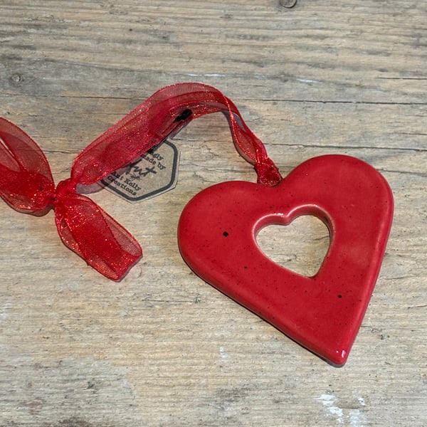 Red heart hanging decorations with cut out heart