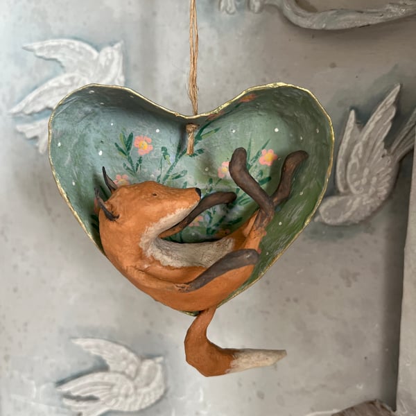 Paper mache fox in a hanging heart