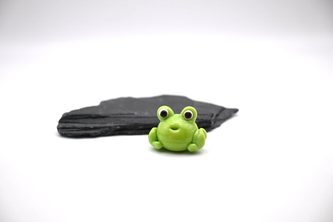 small glass frog figure