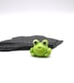 small glass frog figure