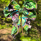 Hair bow on band in bold floral print