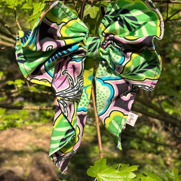 Hair bow on band in bold floral print