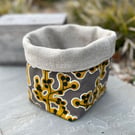 Mustard and grey cotton and linen reversible storage basket plant pot