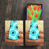 Matchbox art. Tulips in blue vase.