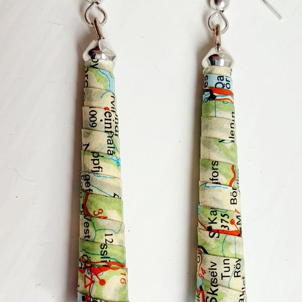Long,  thin, conical paper beaded earrings made with an old map of Norway