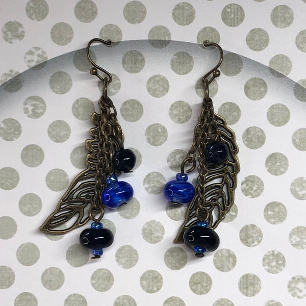 Blue Goldstone and feather earrings