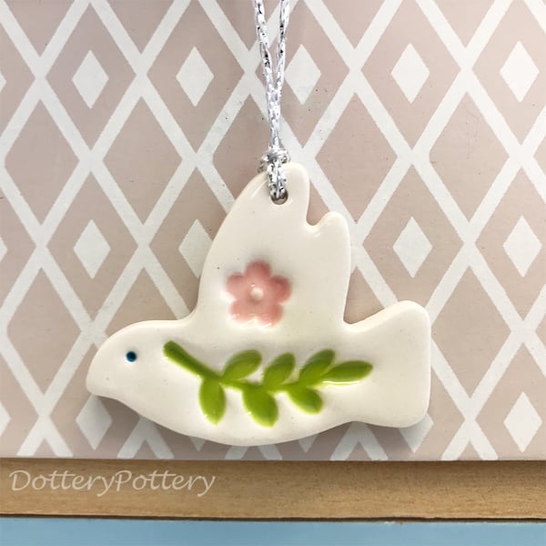 Teeny ceramic dove decoration with leaves and pink flower