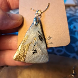 Lovely triangular silver, white, black and gold flecked pendant