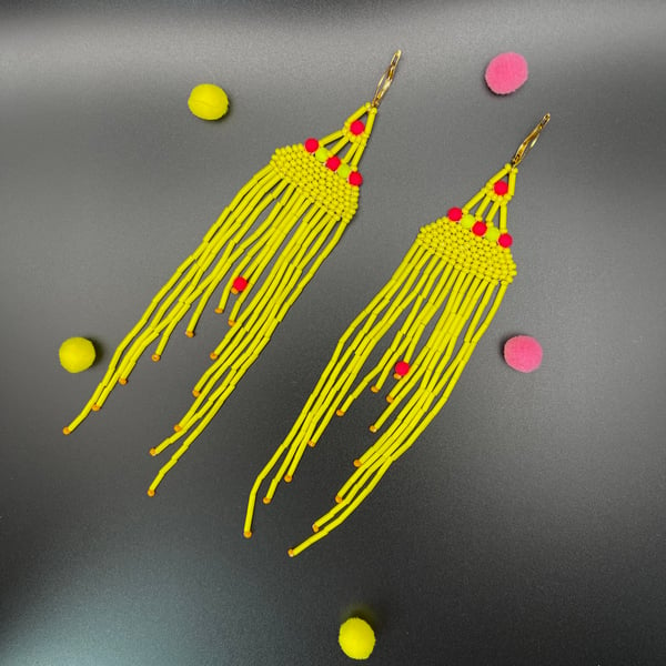 Neon yellow, bead pink chandelier earrings. Changing colours to orange,lime