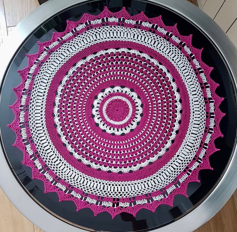 Handmade crochet doily. 100% cotton. Colour fuchsia and cream. 19” diameter.