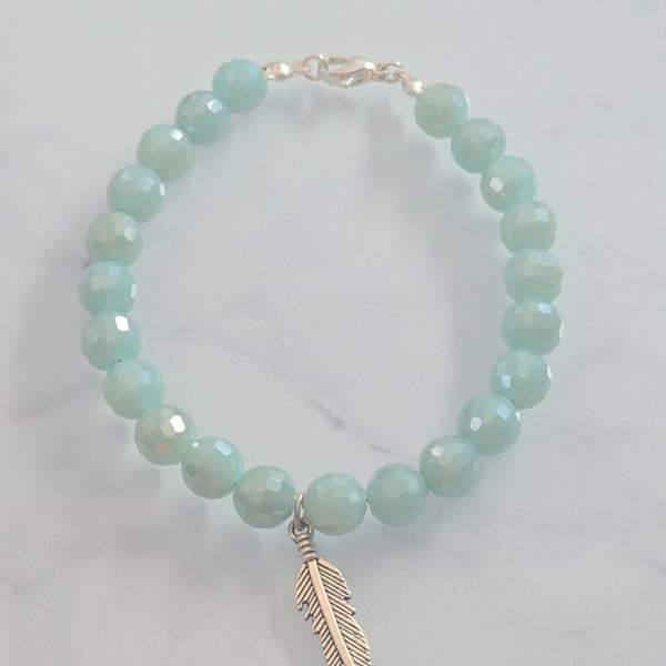 Turquoise faceted bracelet with feather charm