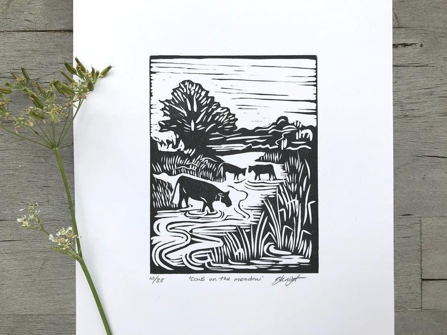 Cows on the meadow: Hand printed lino cut print by Suffolk artist Beth Knight.