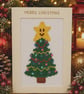 Handmade Cross Stitch Smiley Christmas Tree Card – 8 x 6 Inch - Image 1