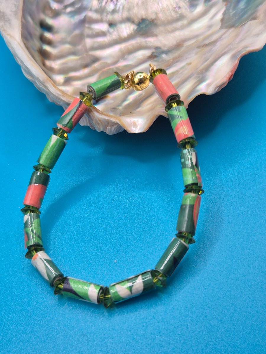 Paper beaded  orange and green bracelet with light reflecting beads
