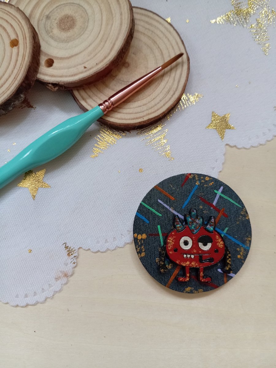 Wooden circular red monster fridge magnet 