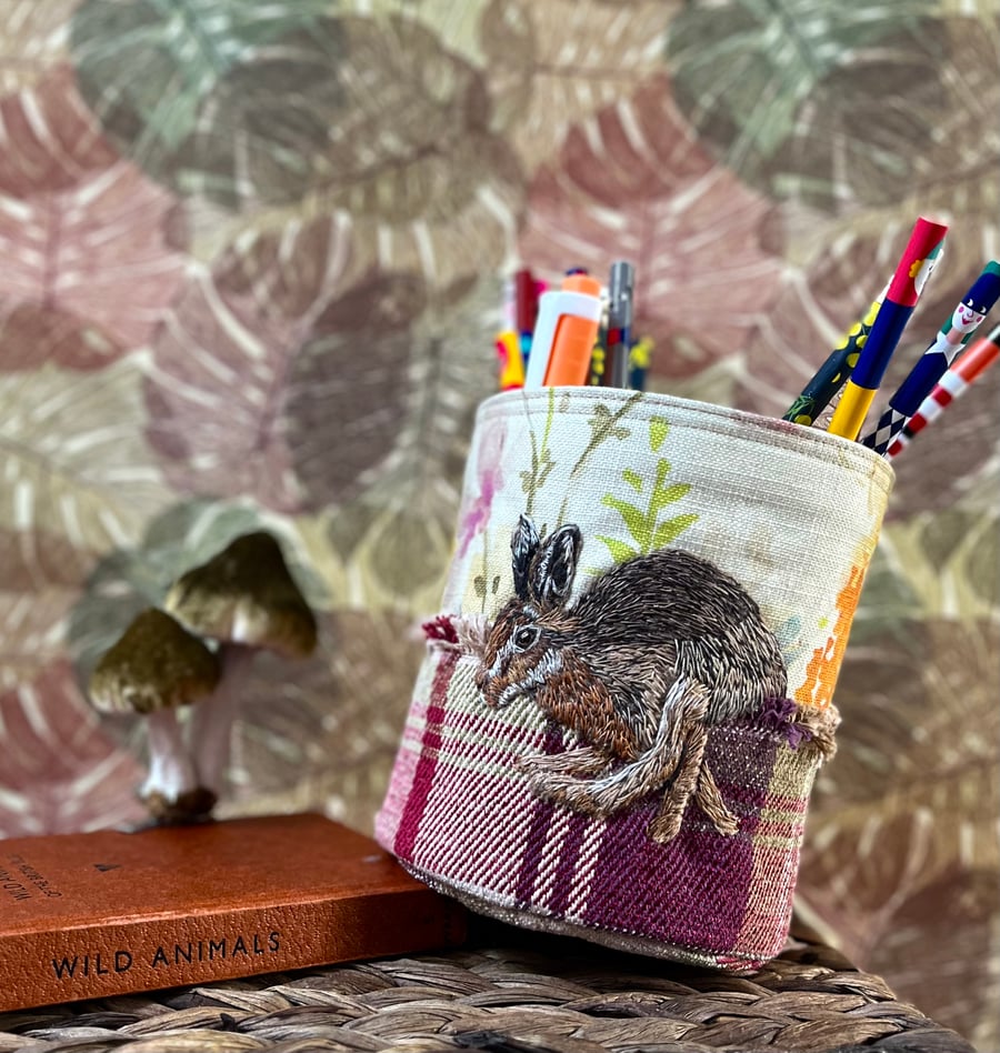 Textile storage pot with hand embroidered hare