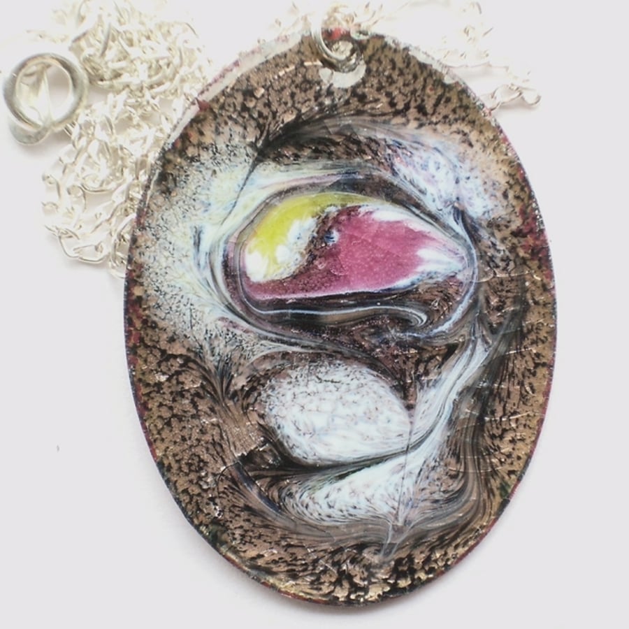 pendant - oval: scrolled dark pink, gold, white on black over clear enamel