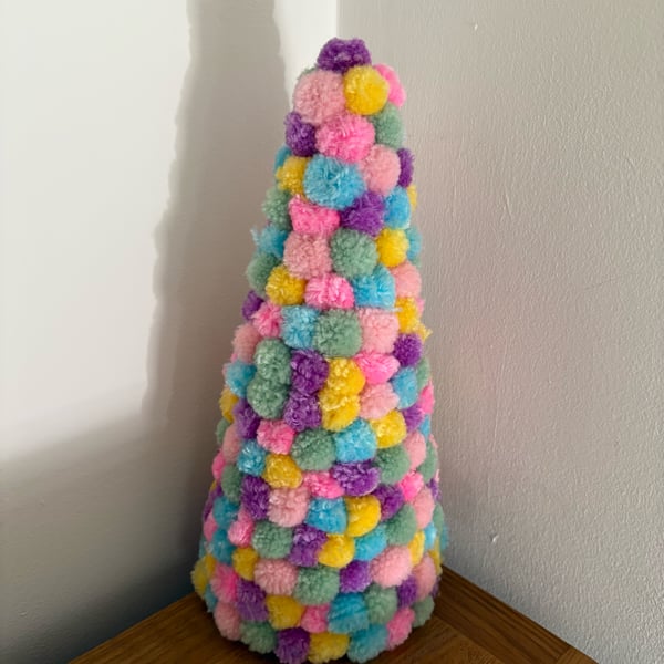 Pastel rainbow Pom Pom decorated cone. 