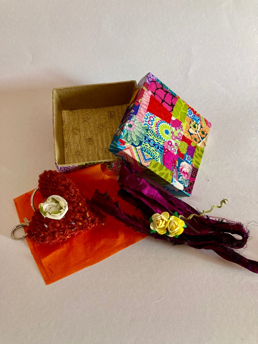 Hand knitted key ring presented in a gift box