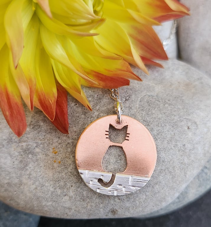 Copper and  sterling silver cat on a wall pendant