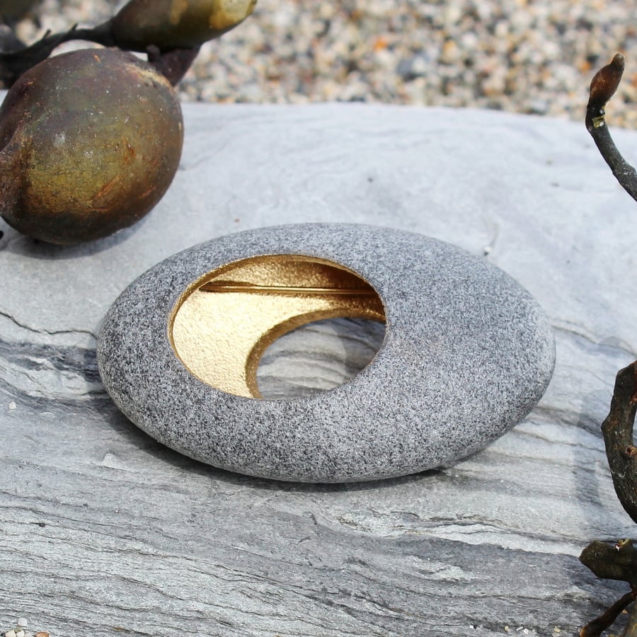 Pebble brooch, nature inspired with a golden hollow centre. A John Field design