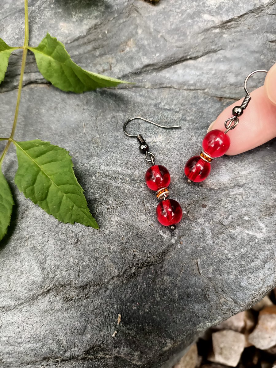 Black and red beaded dangle drop earrings with tangerine sparkle spacer