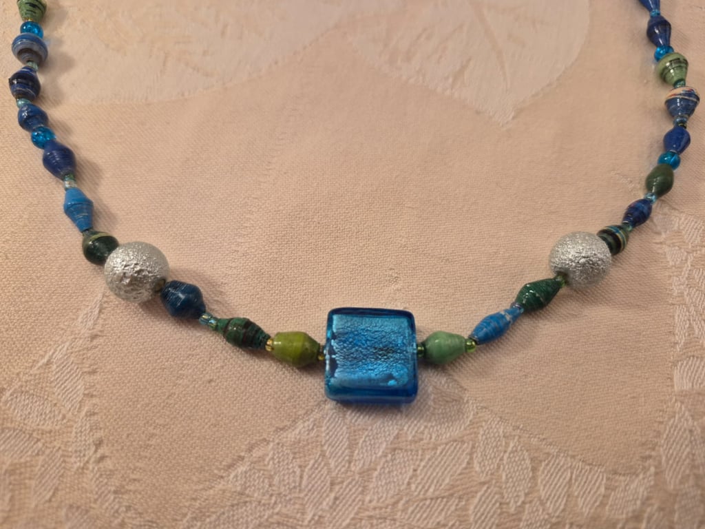 Vibrant beaded necklace in blues & greens with accent silver & blue beads
