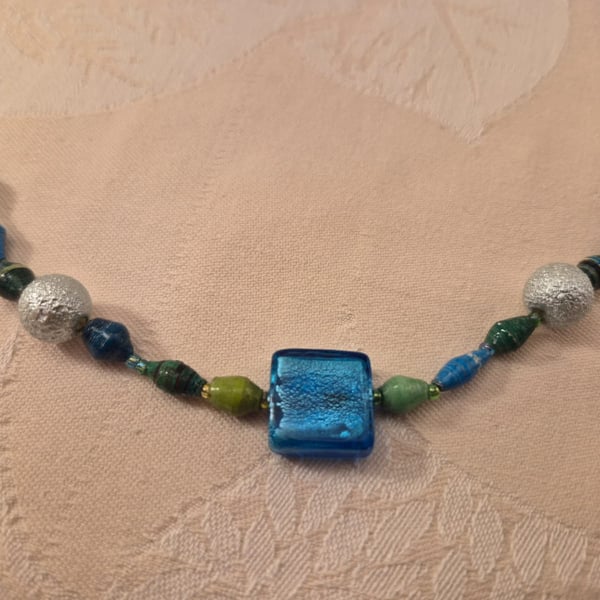 Beaded necklace in blues & greens with accent silver & blue beads