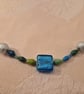 Beaded necklace in blues & greens with accent silver & blue beads