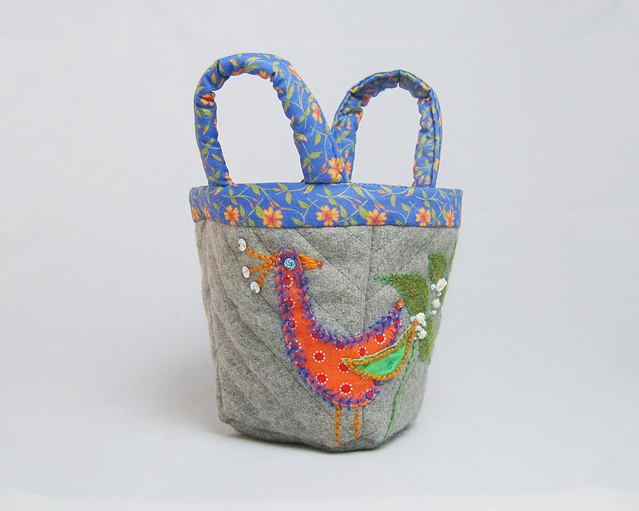 Grey bijou project bag with appliquéd bird and dead nettle embroidery