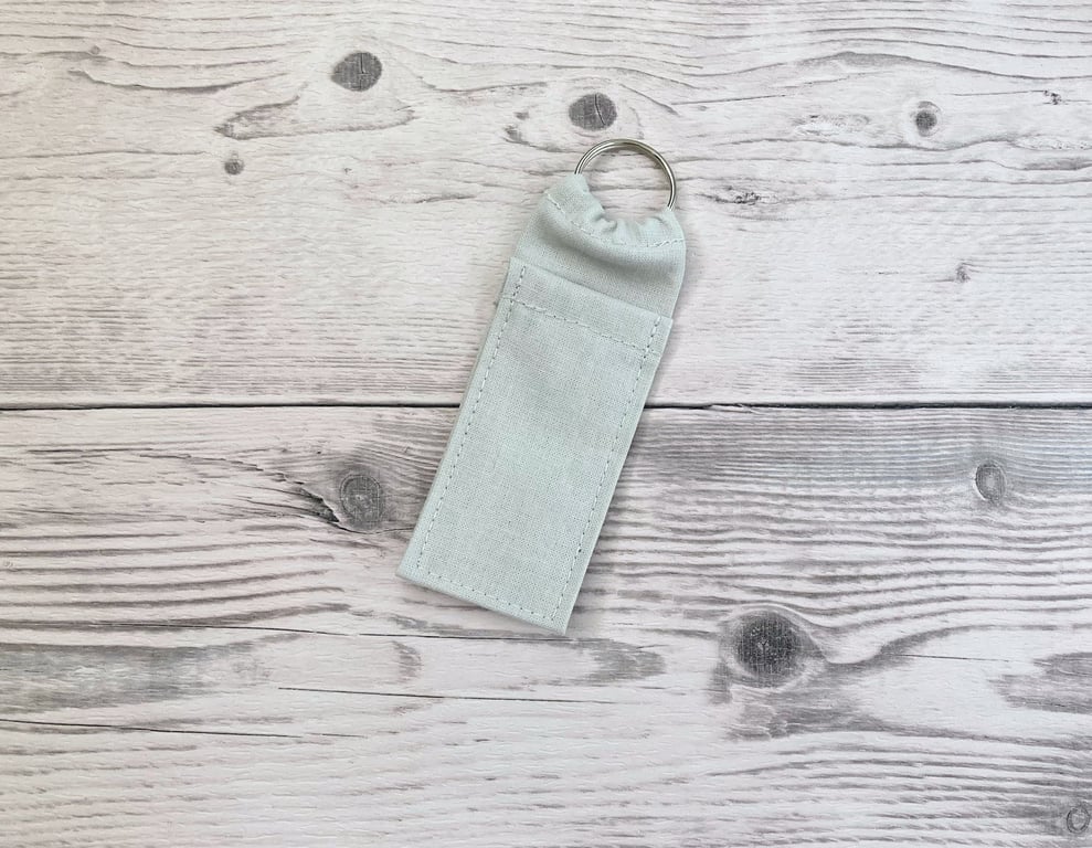 Light grey plain lip balm holder. Lipstick cotton fabric keychain.